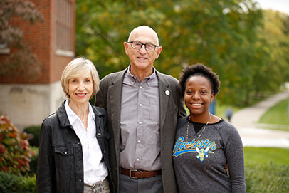 Three people smiling. Links to Ages 60-70.