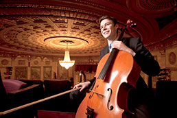 A student playing the cello. Links to Reunion giving